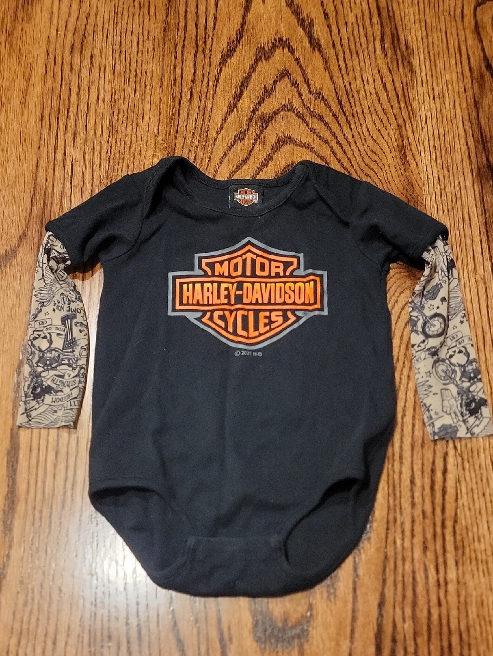 Harley-Davidson Black Bodysuit with Orange Logo and Tan Sleeves